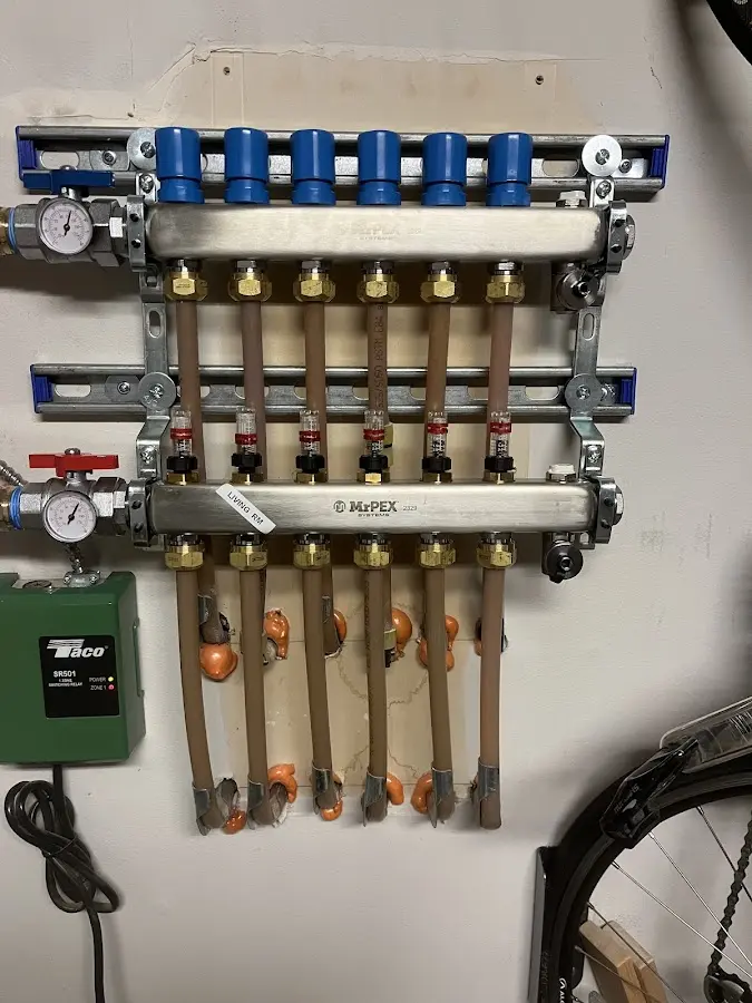 Plumber performing Water Heater Repair at a residential property in Mancelona